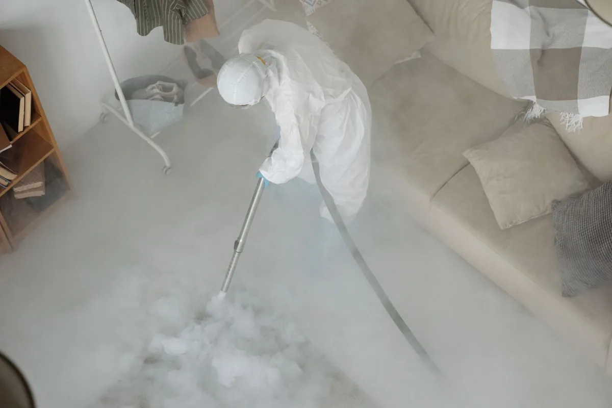 Biohazard cleanup technician in protective equipment, Wasilla, AK